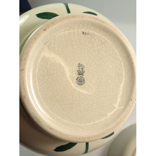 22 - A Royal Doulton jardiniere painted stylised flowers 21.5cm diameter and a Royal Doulton floral paint... 