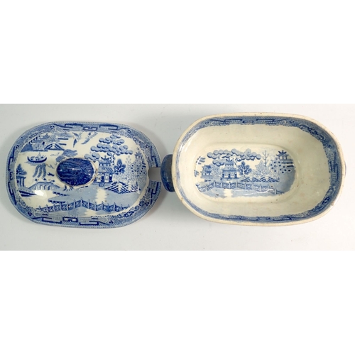 24 - An Abbey blue and white Shredded Wheat dish and a 19th century willow pattern sauce tureen and lid