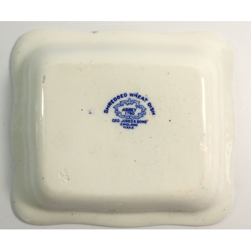 24 - An Abbey blue and white Shredded Wheat dish and a 19th century willow pattern sauce tureen and lid