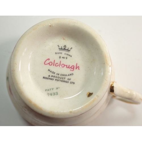 29 - A Colclough tea service printed roses comprising six cups, saucers and tea plates, milk, sugar and c... 