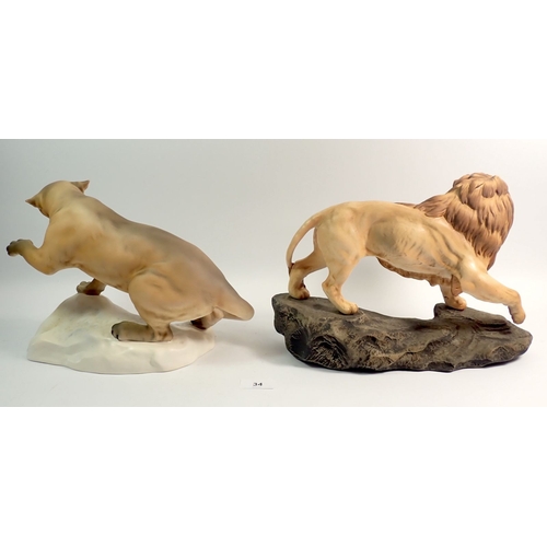 34 - A large Beswick bisque lion 31cm wide and a similar cougar