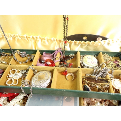 516 - A box of various costume jewellery including octagonal 9 carat gold front and back engraved heart lo... 