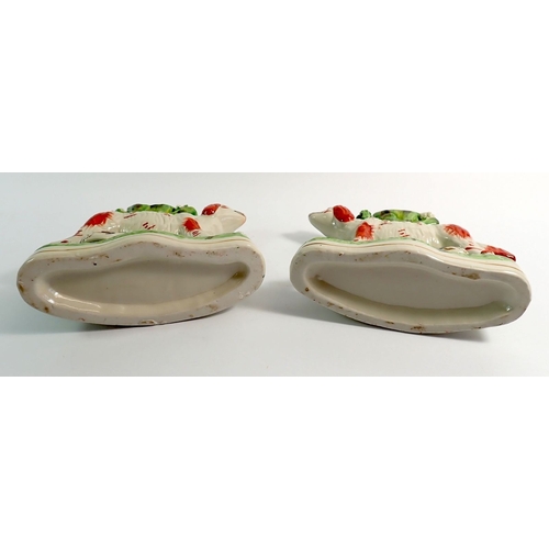 27 - A pair of Victorian style flat back Staffordshire dogs, 17cm tall