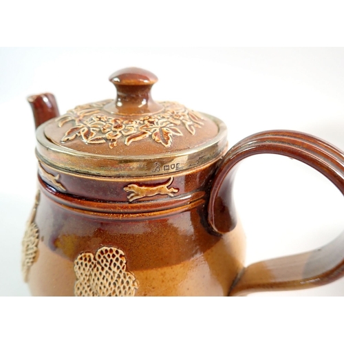 49 - A Doulton stoneware teapot with silver rim plus a studio pottery tankard and flask, 21cm tall