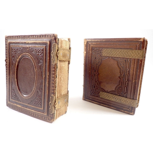 655 - Two Victorian photograph albums and contents of Carte de Visite, fifty four photographs in total