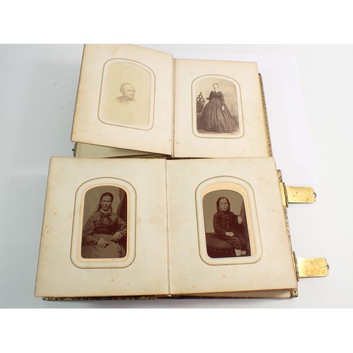 655 - Two Victorian photograph albums and contents of Carte de Visite, fifty four photographs in total