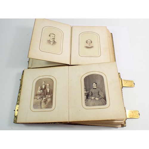 655 - Two Victorian photograph albums and contents of Carte de Visite, fifty four photographs in total