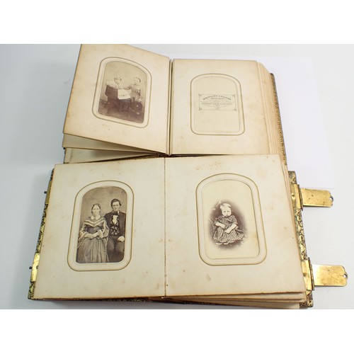 655 - Two Victorian photograph albums and contents of Carte de Visite, fifty four photographs in total