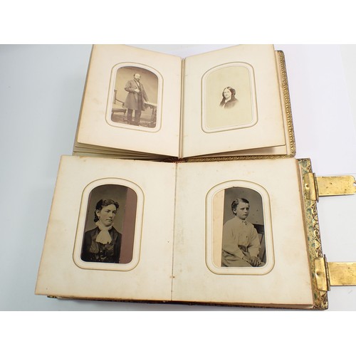 655 - Two Victorian photograph albums and contents of Carte de Visite, fifty four photographs in total