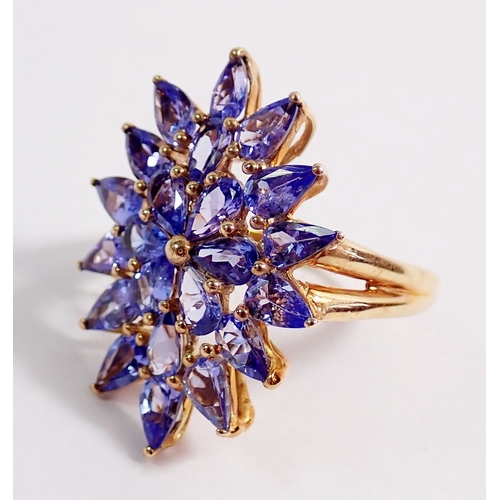 274 - A 9ct gold large starburst design tanzanite ring, 4.5g, size N, 2.8 x 1.5cm