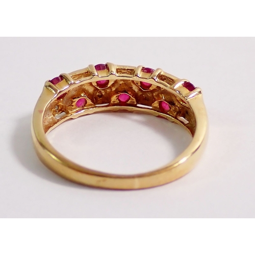 287 - A 9ct gold ring set seven rubies and seven illusion set diamonds, size K, 2.3g