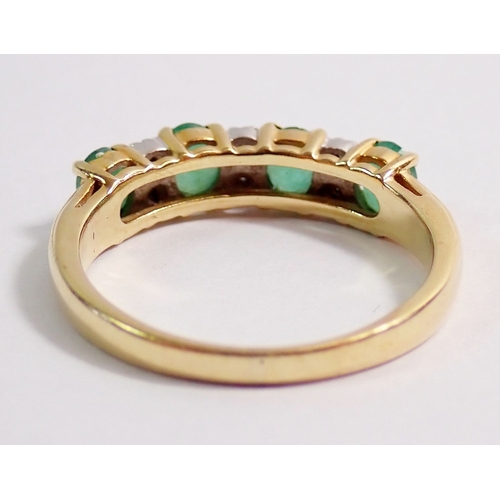 288 - A 9ct gold ring set four small emeralds interspered with six small diamonds, 2.2g, size L