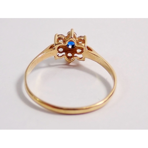 289 - A 9ct gold floral blue and white stone cluster ring, 1.2g size O to P