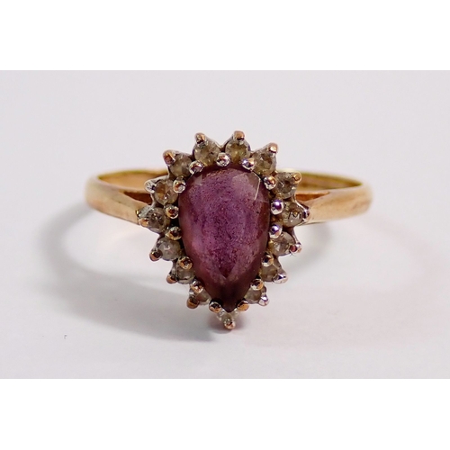 292 - A 9ct gold ring set pear cut amethyst in diamond surround, size J, 1.7g