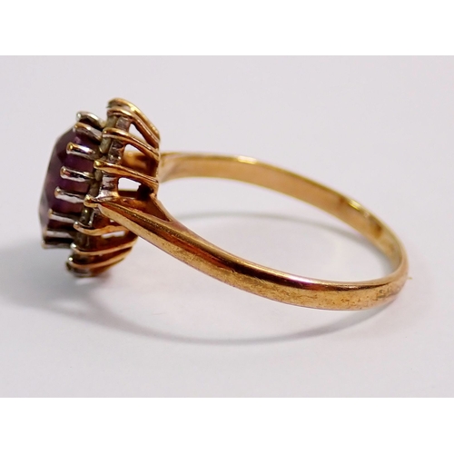 292 - A 9ct gold ring set pear cut amethyst in diamond surround, size J, 1.7g