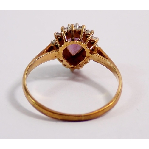 292 - A 9ct gold ring set pear cut amethyst in diamond surround, size J, 1.7g