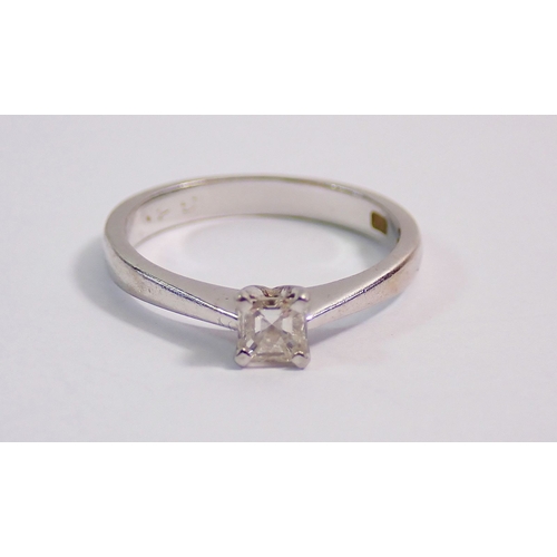 294 - A platinum solitaire ring set princess cut diamond, size K, 2.9g