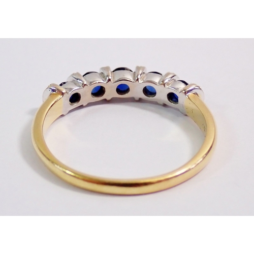 295 - An 18 carat gold ring set five sapphires interspersed by six bands of chip diamonds, 4.4g, size T to... 