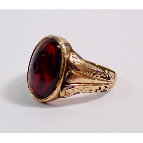299 - A Victorian yellow metal ring set cabochon cut garnet, size N, 3.5g