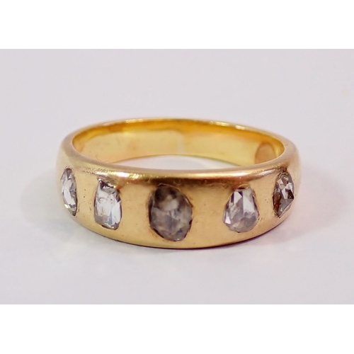 300 - An antique gold ring inset five old cut oval diamonds, tested as 18 carat, size L, 5.6g