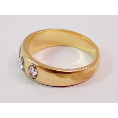 300 - An antique gold ring inset five old cut oval diamonds, tested as 18 carat, size L, 5.6g