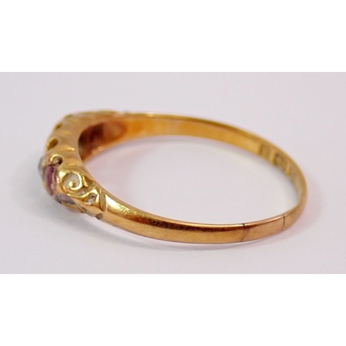 303 - A Victorian 18ct gold ring set three rubies and two diamonds, size M, 1.7g