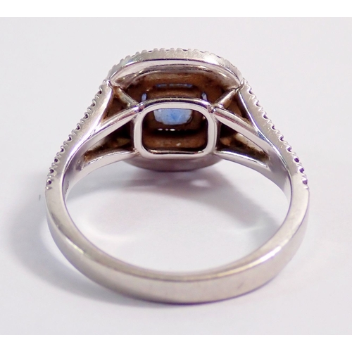 315 - A platinum sapphire and diamond cluster ring set cushion cut sapphire (approx 1.25 cts) within doubl... 