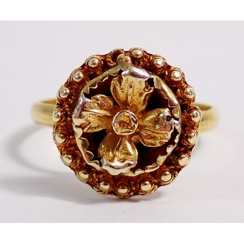 316 - An 18 carat gold flower form ring - not marked but tested, 2.7g, size L