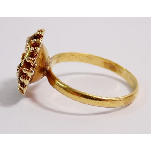 316 - An 18 carat gold flower form ring - not marked but tested, 2.7g, size L