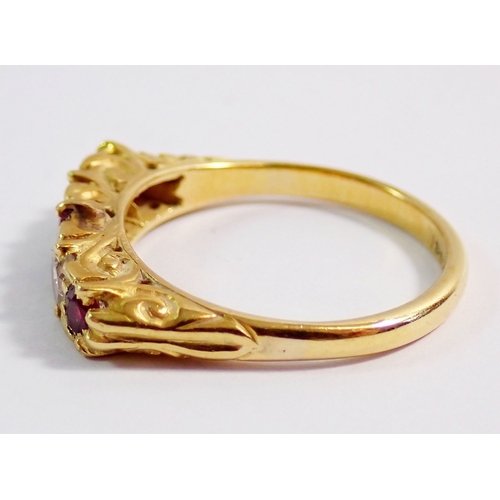 317 - An 18 carat gold ring set three rubies and two diamonds, 3.9g, size M, 42cm