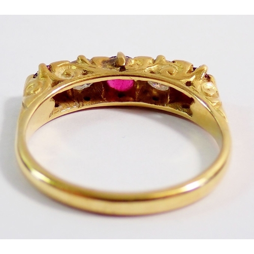 317 - An 18 carat gold ring set three rubies and two diamonds, 3.9g, size M, 42cm