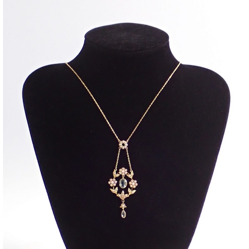 319 - An Edwardian 9ct gold pendant necklace set floral pearl clusters and aquamarine drops, drop 6.2cm, c... 