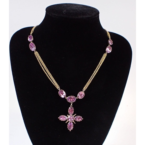 322 - A Victorian amethyst set pendant cross on triple chain gold necklace nterspersed with oval cut ameth... 