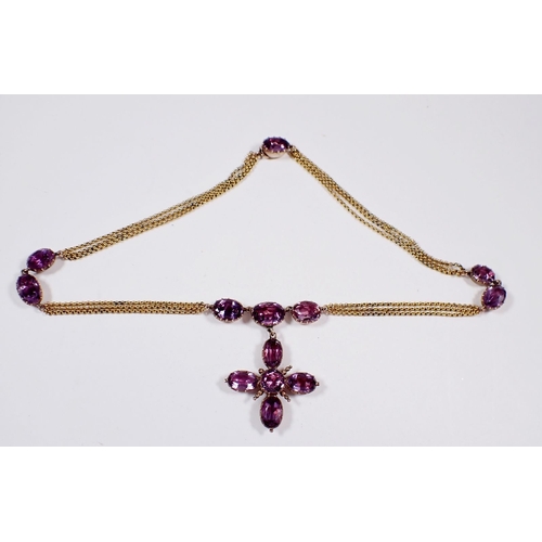 322 - A Victorian amethyst set pendant cross on triple chain gold necklace nterspersed with oval cut ameth... 