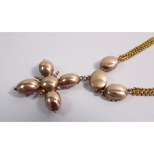 322 - A Victorian amethyst set pendant cross on triple chain gold necklace nterspersed with oval cut ameth... 