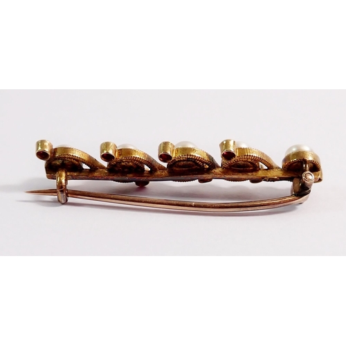 329 - A Victorian 15 carat gold pearl and ruby wave set bar brooch, 3.7g, 3.7cm long