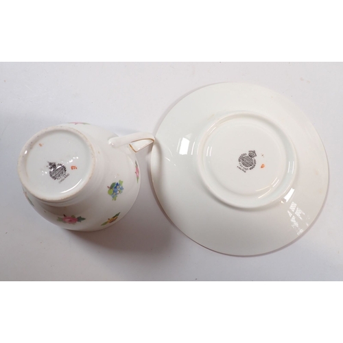 61 - A Mintons 1930's part tea service printed flowers including four cups and saucers, jug, six tea plat... 