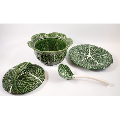 12 - A cabbage leaf pottery tureen and lid with ladle and stand, tureen 25cm diameter