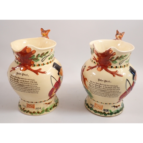 32 - A Crown Devon musical jug working and another without movement, 21cm tall