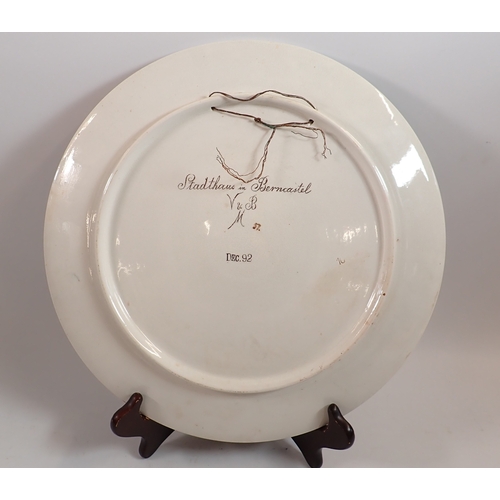 48 - A Villeroy & Boch Mettlach charger plate depicting a Stadthaus in Berncastel, 35.5cm diameter