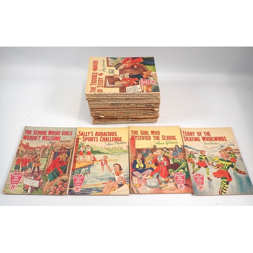 604 - A group of childrens books including Ladybird books, The Schoolgirls Own Library magazines etc.