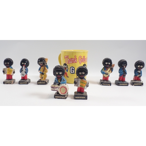 A set of eight plaster Robinson's Jam musician figures and a mug