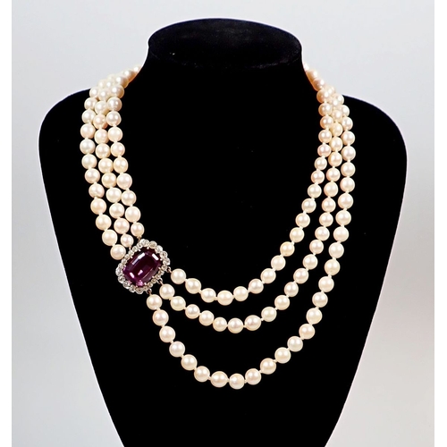 A three string pearl necklace with diamond and amethyst set clasp ...