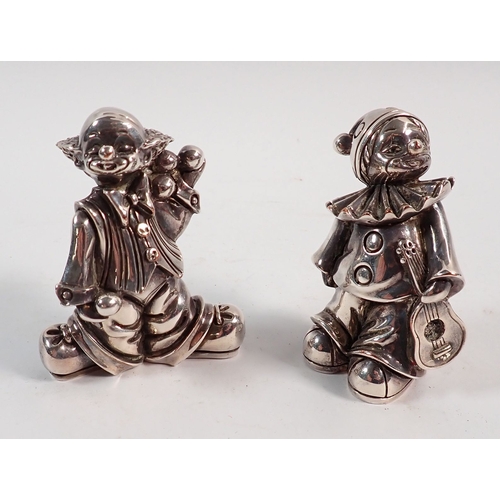 133 - A pair of silver plated on copper clown figures marked Ardi, 7cm tall