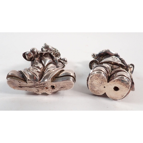 133 - A pair of silver plated on copper clown figures marked Ardi, 7cm tall