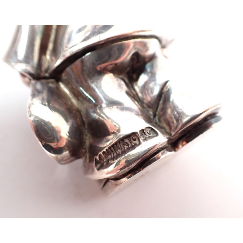 133 - A pair of silver plated on copper clown figures marked Ardi, 7cm tall