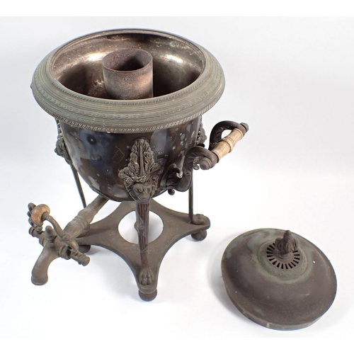 134 - A silver plated samovar with lion mask decoration on paw feet, 36.5cm high