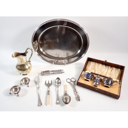 144 - A group of silver plated items including serving cutlery and cruet set