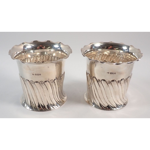 151 - A pair of silver spiral gadrooned bottle holders or coasters by Atkin Bros, Sheffield 1892/1896, 11c... 