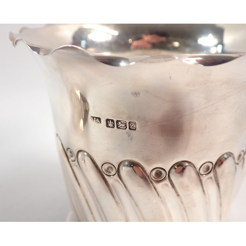 151 - A pair of silver spiral gadrooned bottle holders or coasters by Atkin Bros, Sheffield 1892/1896, 11c... 